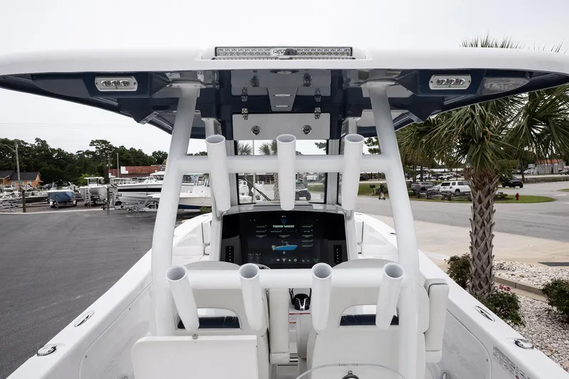 Yacht Photos Pics 2025 Twin Vee 260 GFX2 CC boat console with modern controls and seating.