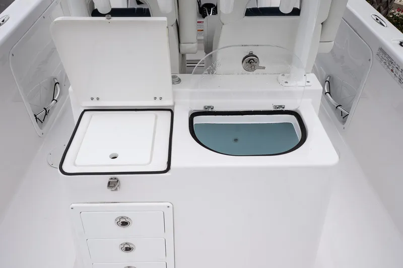  Yacht Photos Pics 2025 Twin Vee 260 GFX2 CC boat interior with storage and sink.