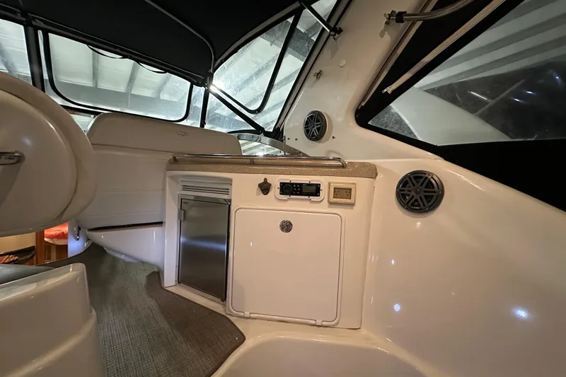 .38 Special Yacht Photos Pics Interior of 2004 Regal Commodore 3860 yacht with kitchenette and seating area.