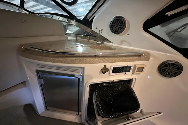 .38 Special Yacht Photos Pics 2004 Regal Commodore 3860 yacht interior with kitchenette, sink, and storage compartments.