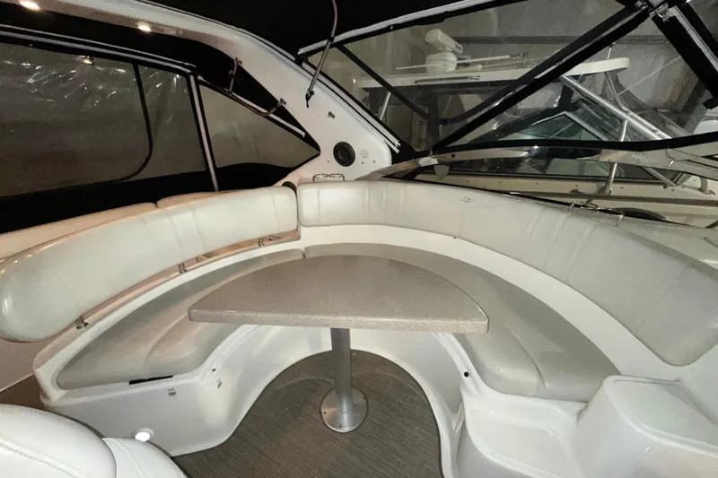 .38 Special Yacht Photos Pics 2004 Regal Commodore 3860 boat interior with curved seating and table.