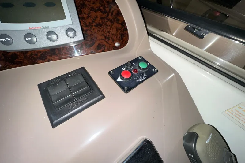 .38 Special Yacht Photos Pics Control panel of a 2004 Regal Commodore 3860 boat with navigation buttons.