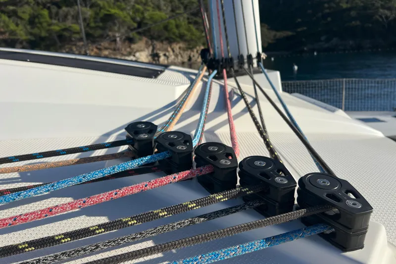 Aria Yacht Photos Pics Close-up of colorful ropes and pulleys on a 2023 Fountaine Pajot Elba 45 Catamaran.