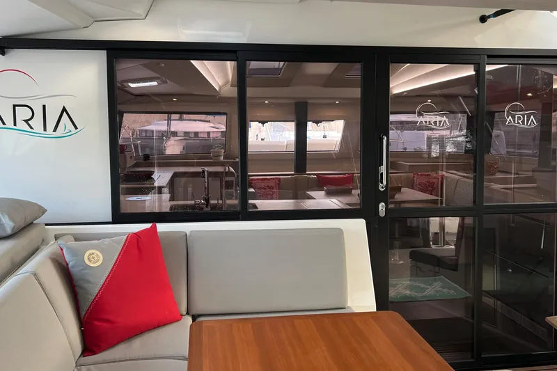 Aria Yacht Photos Pics Interior of 2023 Fountaine Pajot Elba 45 Catamaran with modern seating and decor.