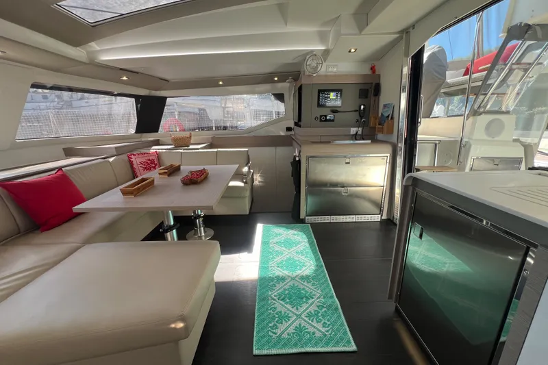 Aria Yacht Photos Pics Luxurious interior of 2023 Fountaine Pajot Elba 45 Catamaran with modern seating and decor.
