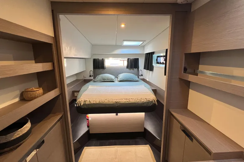 Aria Yacht Photos Pics Luxurious interior of 2023 Fountaine Pajot Elba 45 Catamaran with cozy bedroom.