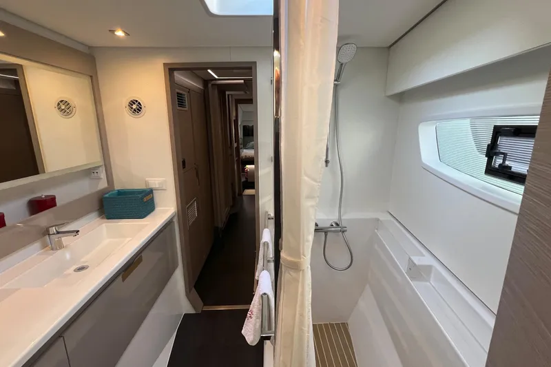 Aria Yacht Photos Pics 2023 Fountaine Pajot Elba 45 Catamaran bathroom with modern fixtures and sleek design.