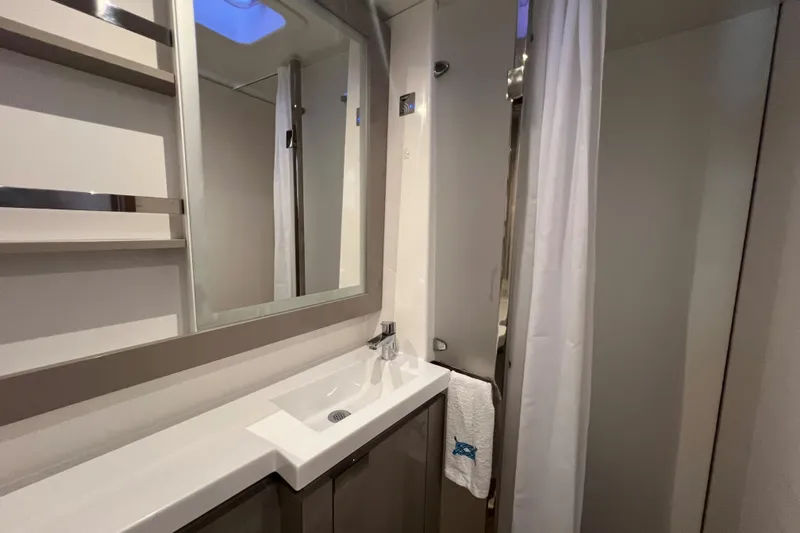 Aria Yacht Photos Pics Modern bathroom interior of 2023 Fountaine Pajot Elba 45 Catamaran with sleek design.