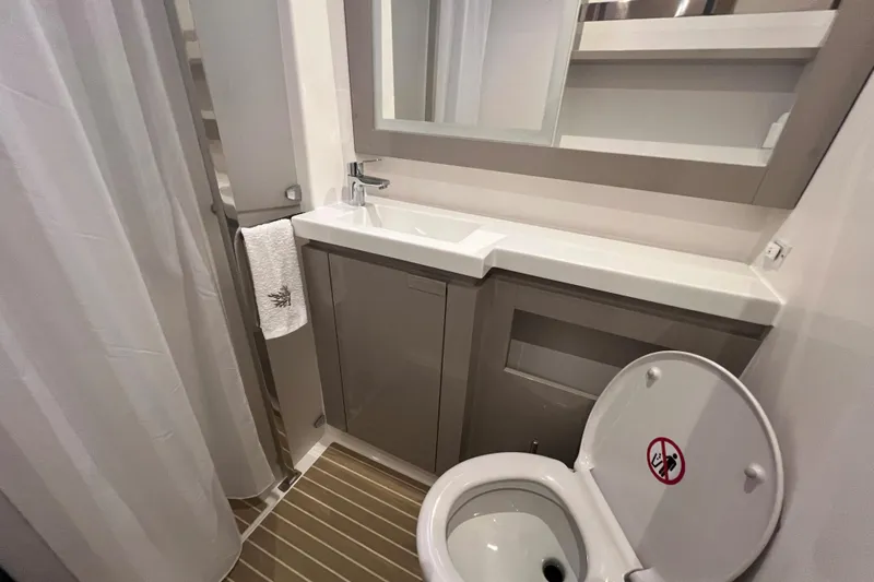 Aria Yacht Photos Pics 2023 Fountaine Pajot Elba 45 Catamaran bathroom with modern sink and toilet.