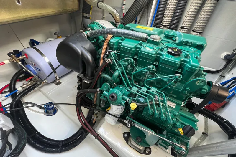 Aria Yacht Photos Pics Engine room of 2023 Fountaine Pajot Elba 45 Catamaran, featuring a green marine engine.