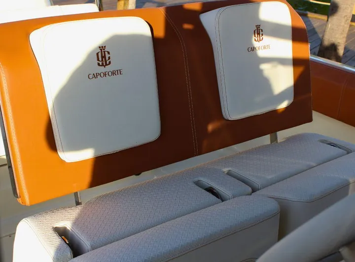  Yacht Photos Pics Luxurious seating on 2024 Capoforte FX270 boat with elegant brown and white upholstery.