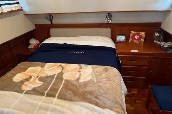Shearwater Yacht Photos Pics Cozy bedroom in 2000 Grand Banks 36 Classic yacht with wooden furnishings.