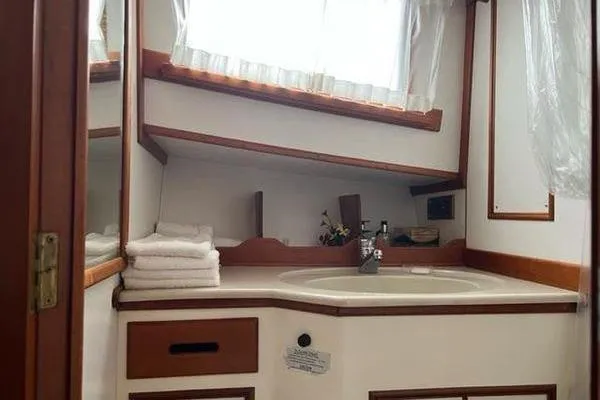 Shearwater Yacht Photos Pics Bathroom interior of 2000 Grand Banks 36 Classic yacht with sink and towels.
