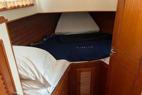Shearwater Yacht Photos Pics Cozy cabin interior of 2000 Grand Banks 36 Classic yacht with wooden paneling.