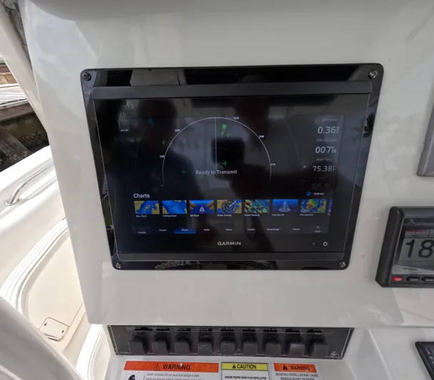  Yacht Photos Pics Garmin navigation display on 2013 Boston Whaler 320 Outrage boat dashboard.