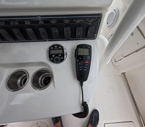  Yacht Photos Pics Control panel of a 2013 Boston Whaler 320 Outrage with radio and cup holders.