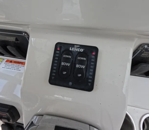  Yacht Photos Pics Control panel of a 2013 Boston Whaler 320 Outrage boat with Lenco trim tab switches.