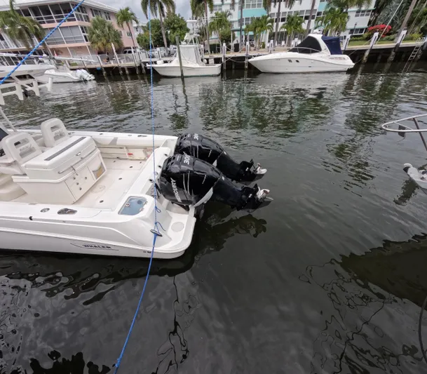  Yacht Photos Pics 2013 Boston Whaler 320 Outrage docked with dual outboard motors, marina background.