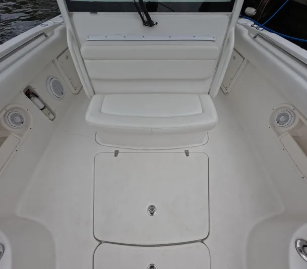  Yacht Photos Pics 2013 Boston Whaler 320 Outrage boat interior with seating and storage compartments.