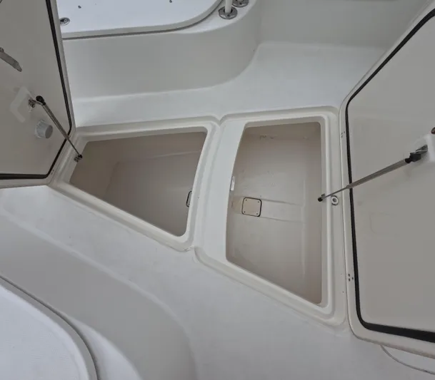 Yacht Photos Pics Open storage compartments on a 2013 Boston Whaler 320 Outrage boat.