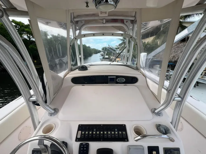  Yacht Photos Pics 2011 Grady-White Canyon 306 boat helm with controls and river view.