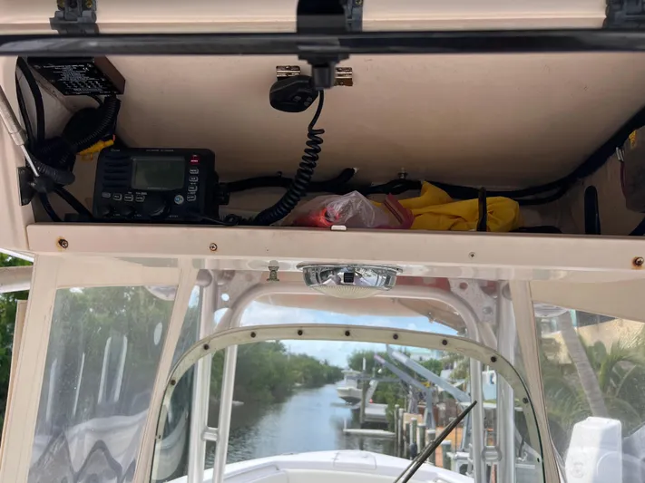  Yacht Photos Pics 2011 Grady-White Canyon 306 boat console with radio and storage compartment.