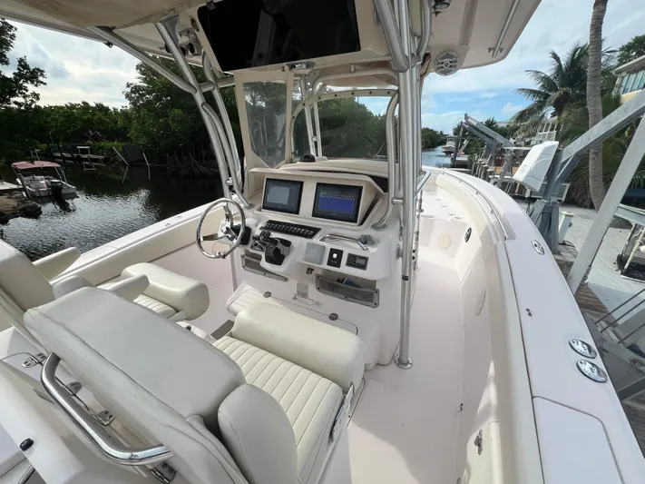  Yacht Photos Pics 2011 Grady-White Canyon 306 boat interior with dual screens and steering wheel.