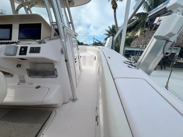  Yacht Photos Pics 2011 Grady-White Canyon 306 boat interior with control panel and seating area.