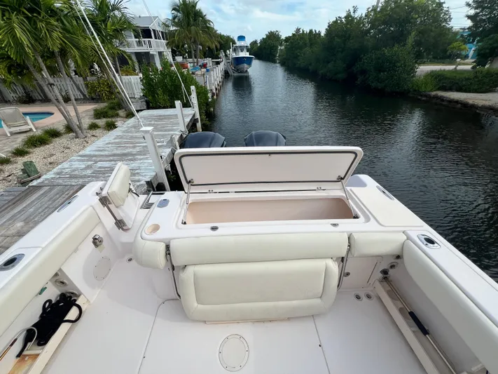 Yacht Photos Pics 2011 Grady-White Canyon 306 boat docked by a scenic canal.