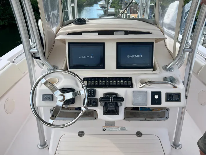  Yacht Photos Pics 2011 Grady-White Canyon 306 boat dashboard with Garmin navigation displays.