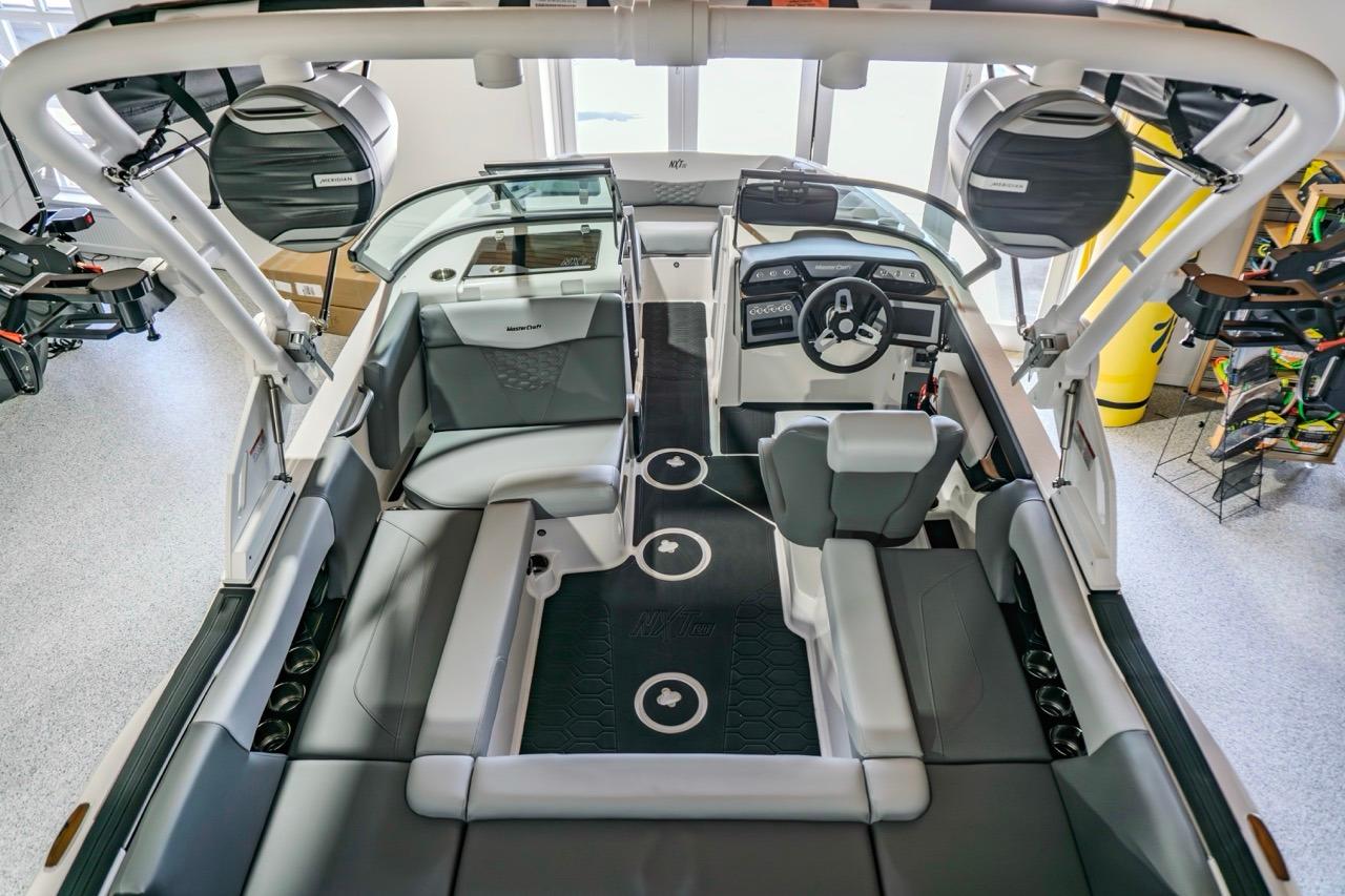 2026 MasterCraft NXT20 boat interior with modern seating and advanced dashboard features.