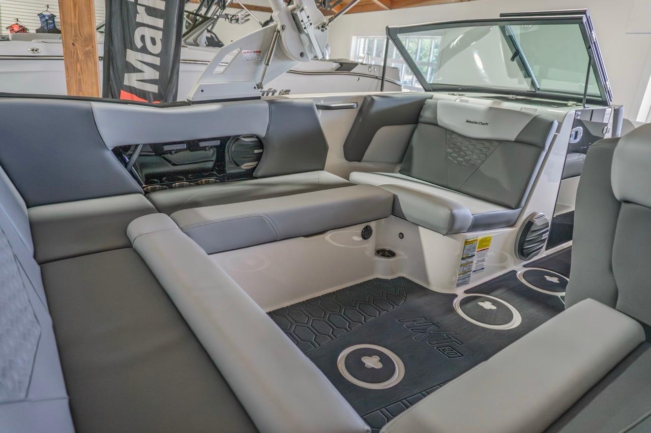 Interior of 2026 MasterCraft NXT20 boat with sleek gray seating and modern design.