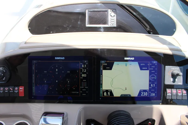 Happy Ours Yacht Photos Pics Control panel of 2008 Chaparral 350 Signature Extended Plane with Simrad navigation displays.