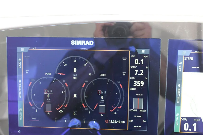 Happy Ours Yacht Photos Pics Simrad marine display on 2008 Chaparral 350 Signature Extended Plane, showing navigation data.