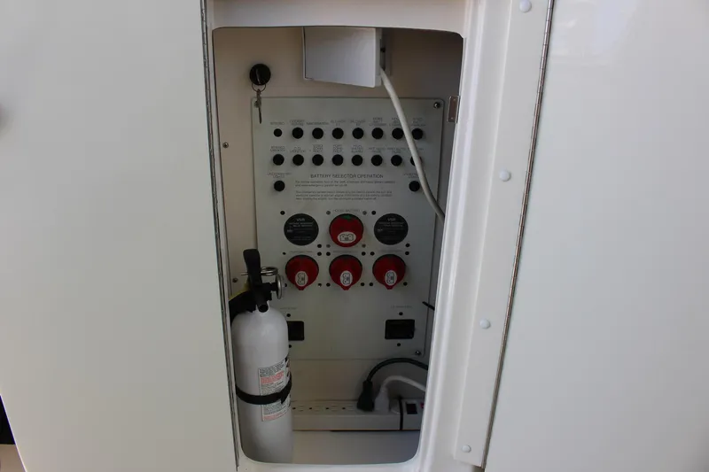 Happy Ours Yacht Photos Pics Control panel of 2008 Chaparral 350 Signature Extended Plane with fire extinguisher.