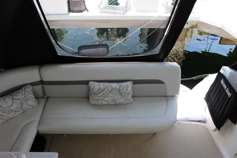 Happy Ours Yacht Photos Pics Interior view of 2008 Chaparral 350 Signature yacht with elegant seating and decorative pillows.