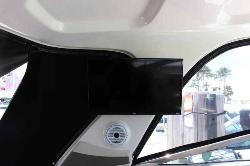 Happy Ours Yacht Photos Pics Interior of 2008 Chaparral 350 Signature with mounted TV and speaker.