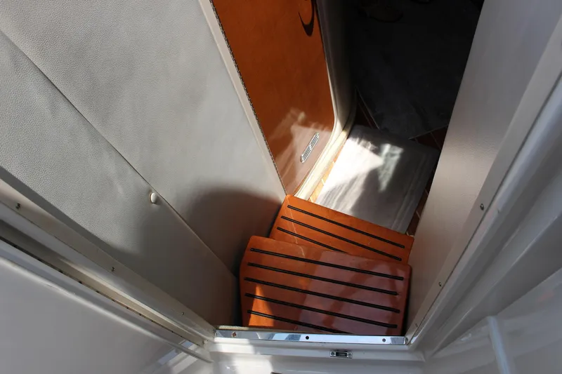 Happy Ours Yacht Photos Pics Stairway inside 2008 Chaparral 350 Signature Extended Plane boat, featuring wooden steps.