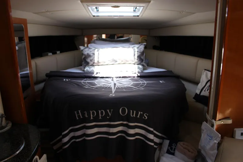 Happy Ours Yacht Photos Pics Luxurious cabin interior of 2008 Chaparral 350 Signature yacht with cozy bedding.