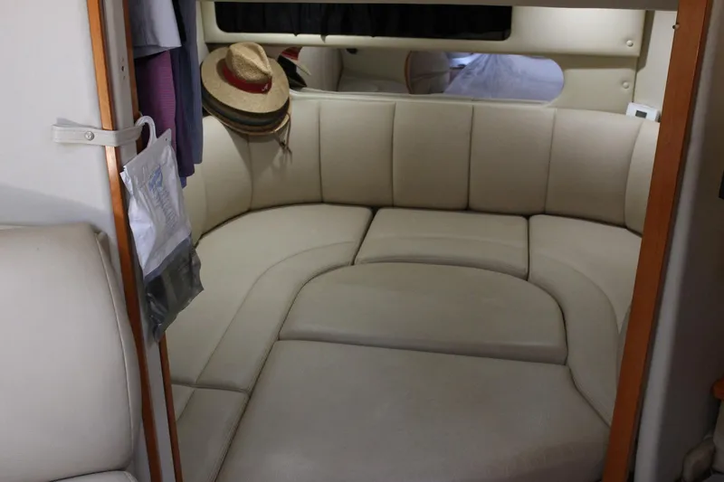 Happy Ours Yacht Photos Pics Interior of 2008 Chaparral 350 Signature boat with beige seating and hats.