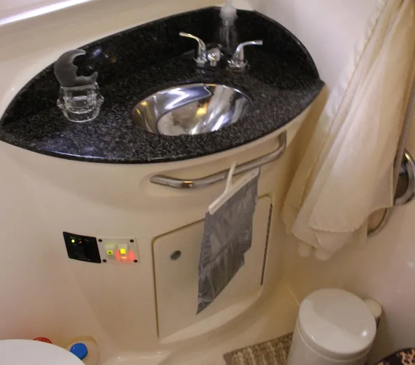 Happy Ours Yacht Photos Pics 2008 Chaparral 350 Signature bathroom with granite countertop and stainless steel sink.