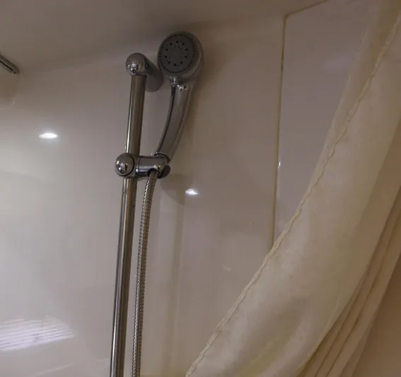 Happy Ours Yacht Photos Pics Shower area in 2008 Chaparral 350 Signature Extended Plane boat, featuring chrome fixtures.