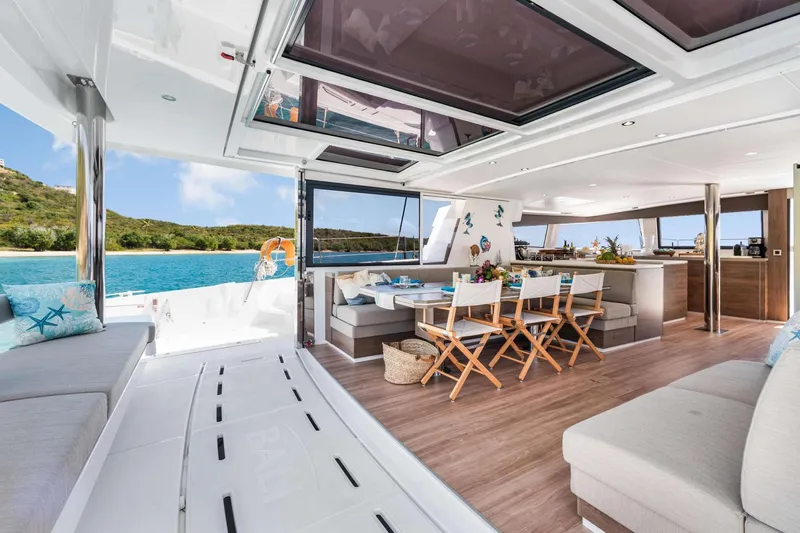 C Sisters Yacht Photos Pics Luxurious interior of 2023 Bali 5.4 Catamaran with spacious seating and dining area.