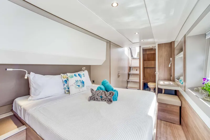 C Sisters Yacht Photos Pics Luxurious interior of 2023 Bali 5.4 Catamaran with cozy bedroom and modern amenities.