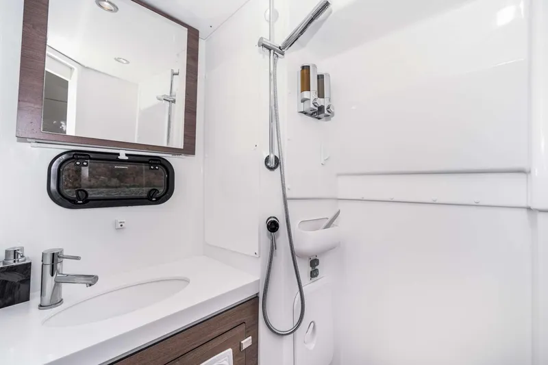 C Sisters Yacht Photos Pics Modern bathroom in 2023 Bali 5.4 Catamaran with sleek fixtures and shower.
