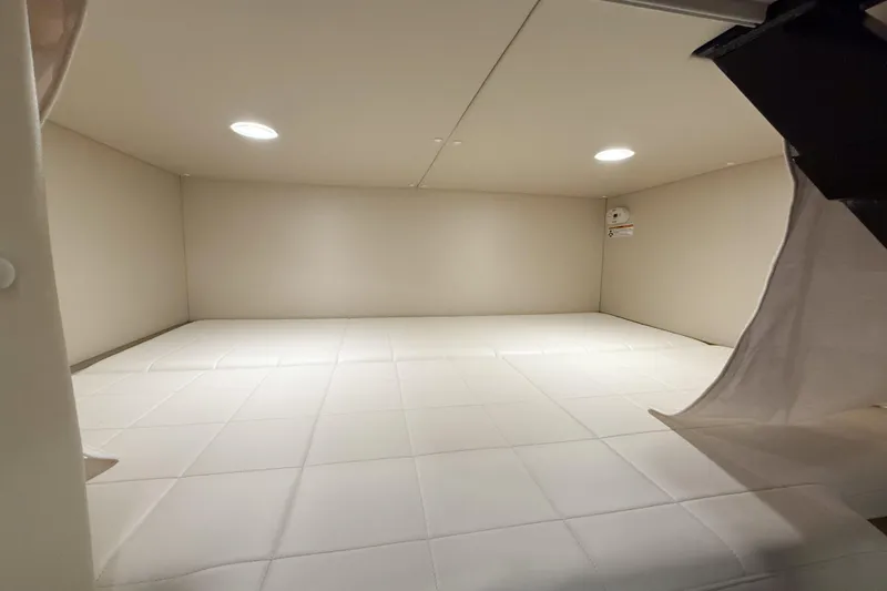 In Stock Yacht Photos Pics Interior cabin of 2026 MJM 47X yacht, featuring spacious, well-lit sleeping area.