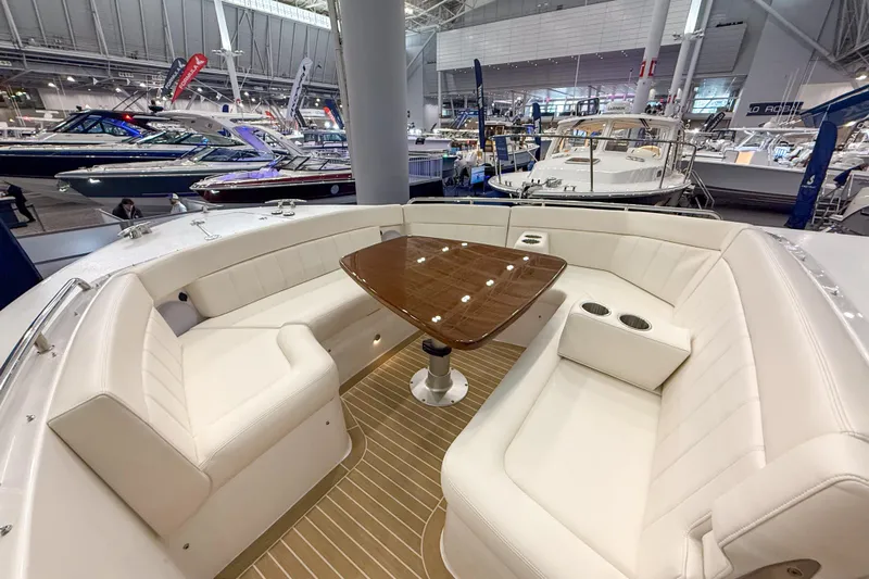 In Stock Yacht Photos Pics Luxurious seating area on 2026 MJM 47X yacht at a boat show.
