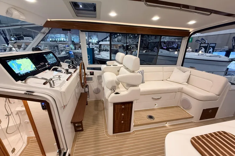 In Stock Yacht Photos Pics Luxurious interior of 2026 MJM 47X yacht with modern helm and plush seating.