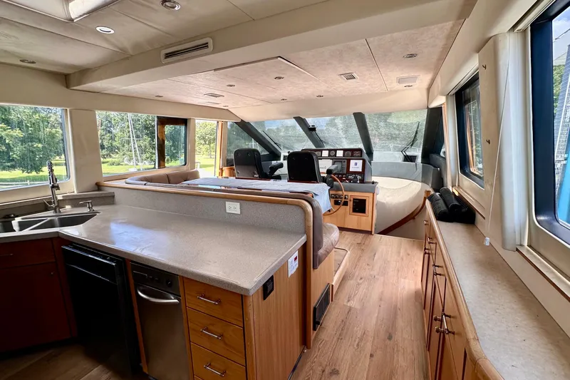 Chasing Sunsets Yacht Photos Pics Interior of 2000 Pacific Mariner 65 Motoryacht with modern kitchen and helm station.