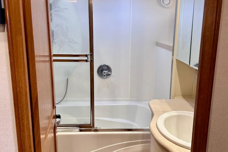 Chasing Sunsets Yacht Photos Pics Bathroom interior of 2000 Pacific Mariner 65 Motoryacht with shower and sink.